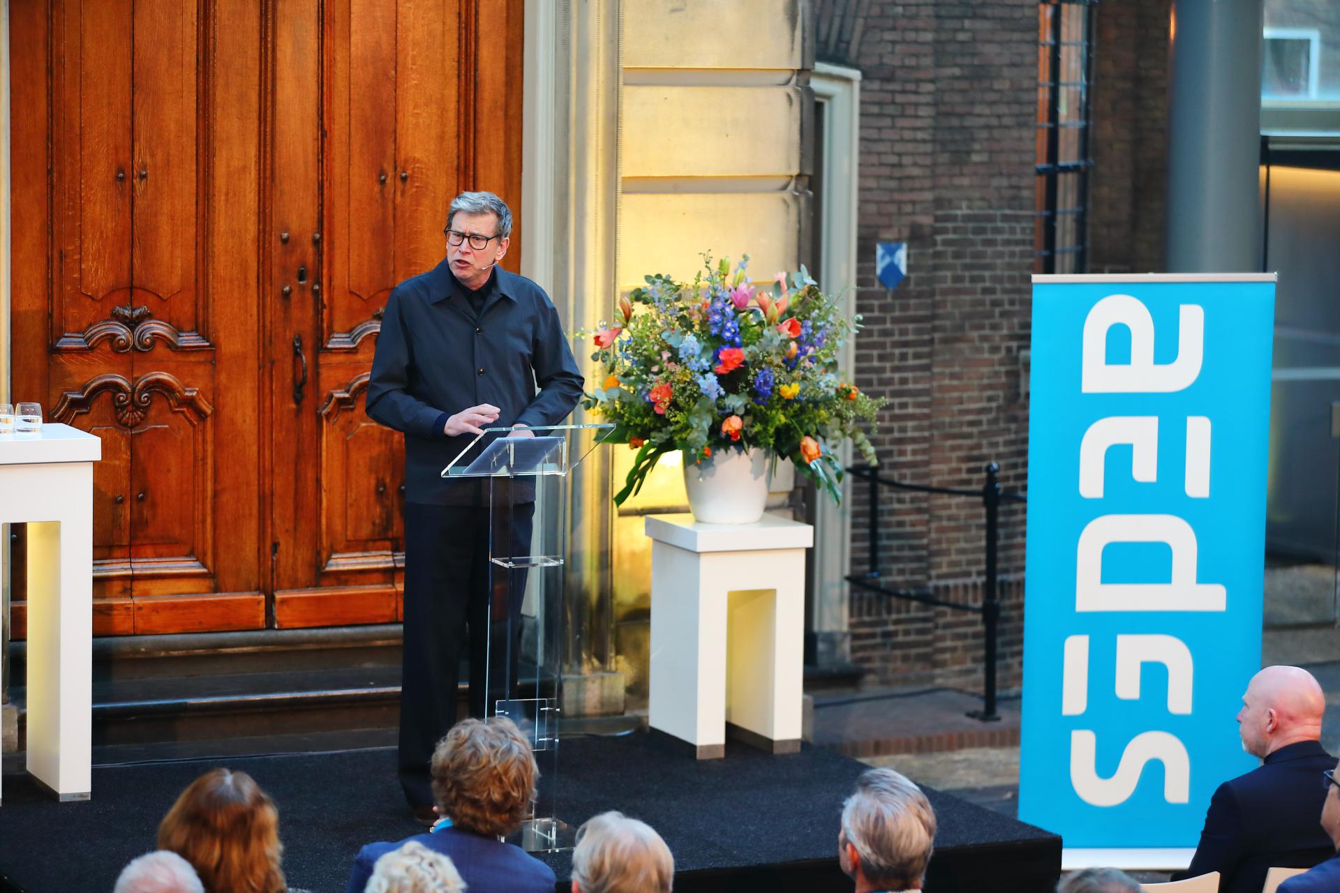 Zef Hemel tijdens de Waarde van Wonen Lezing